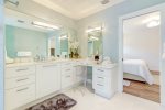 Master ensuite features a makeup vanity -streamlines couples morning routine-
